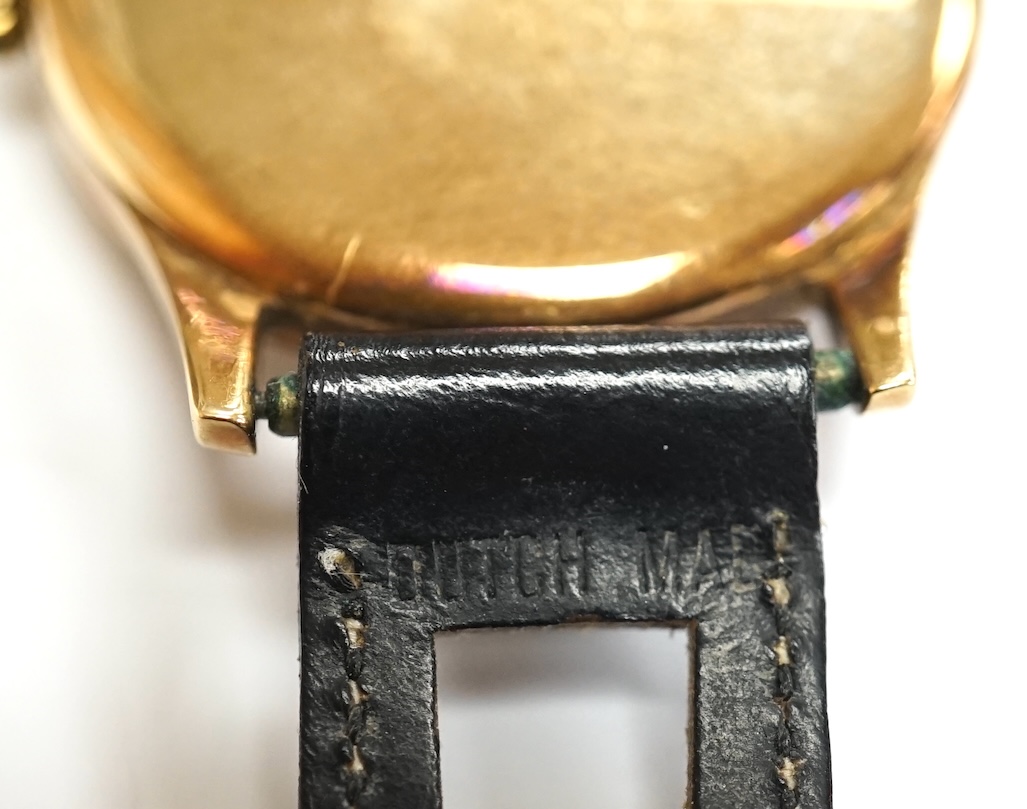 A gentleman's 9ct gold Longines manual wind wrist watch, with subsidiary seconds, case diameter 34mm, on a later associated leather strap, with Longines box. Condition - fair